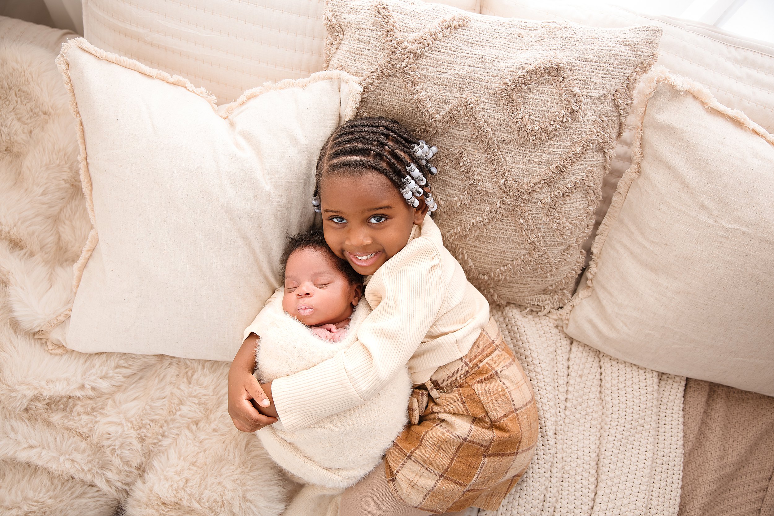 sibling poses during newborn photography session in Madison CT