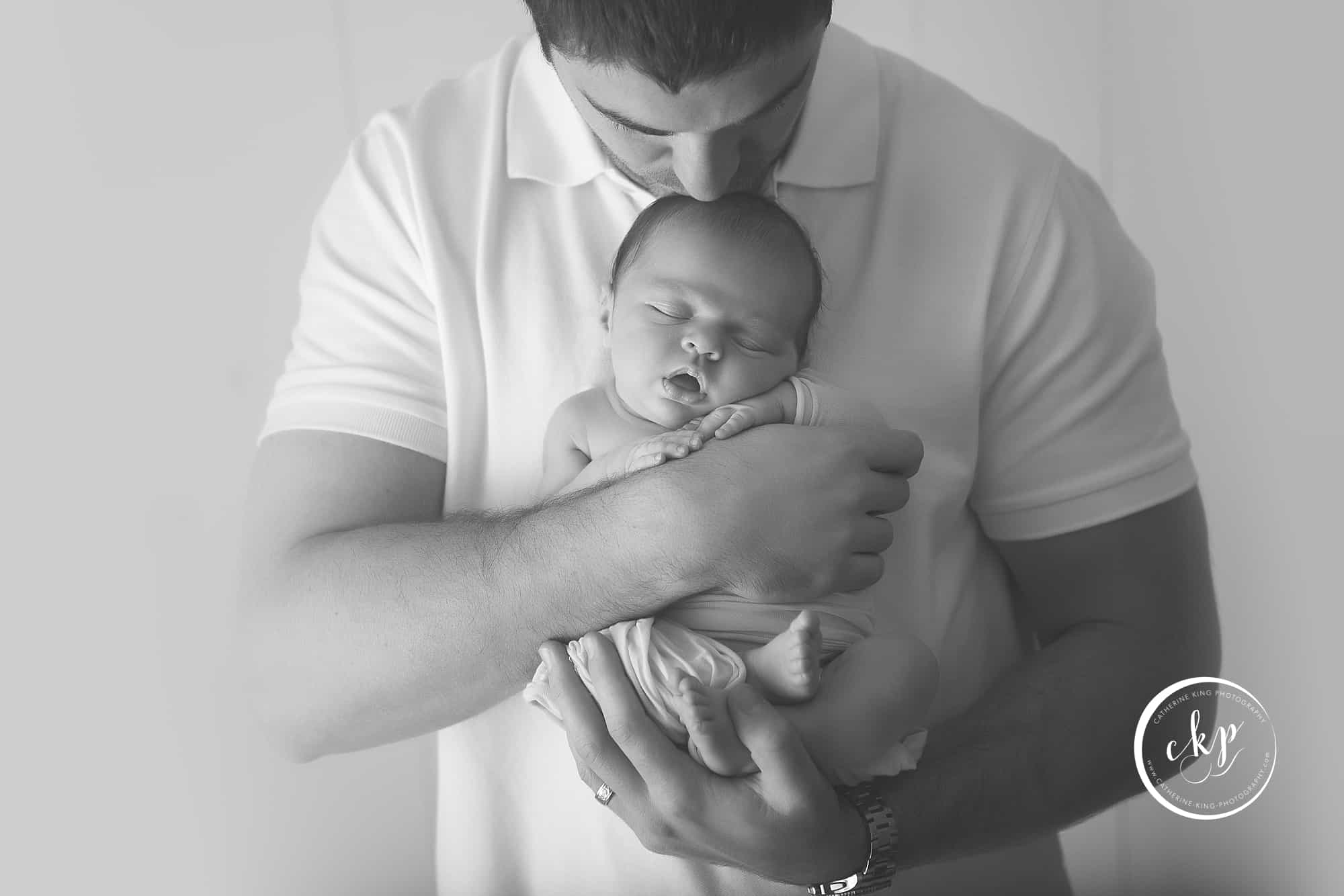dad and new baby captured by one of the top ct professional newborn photographers