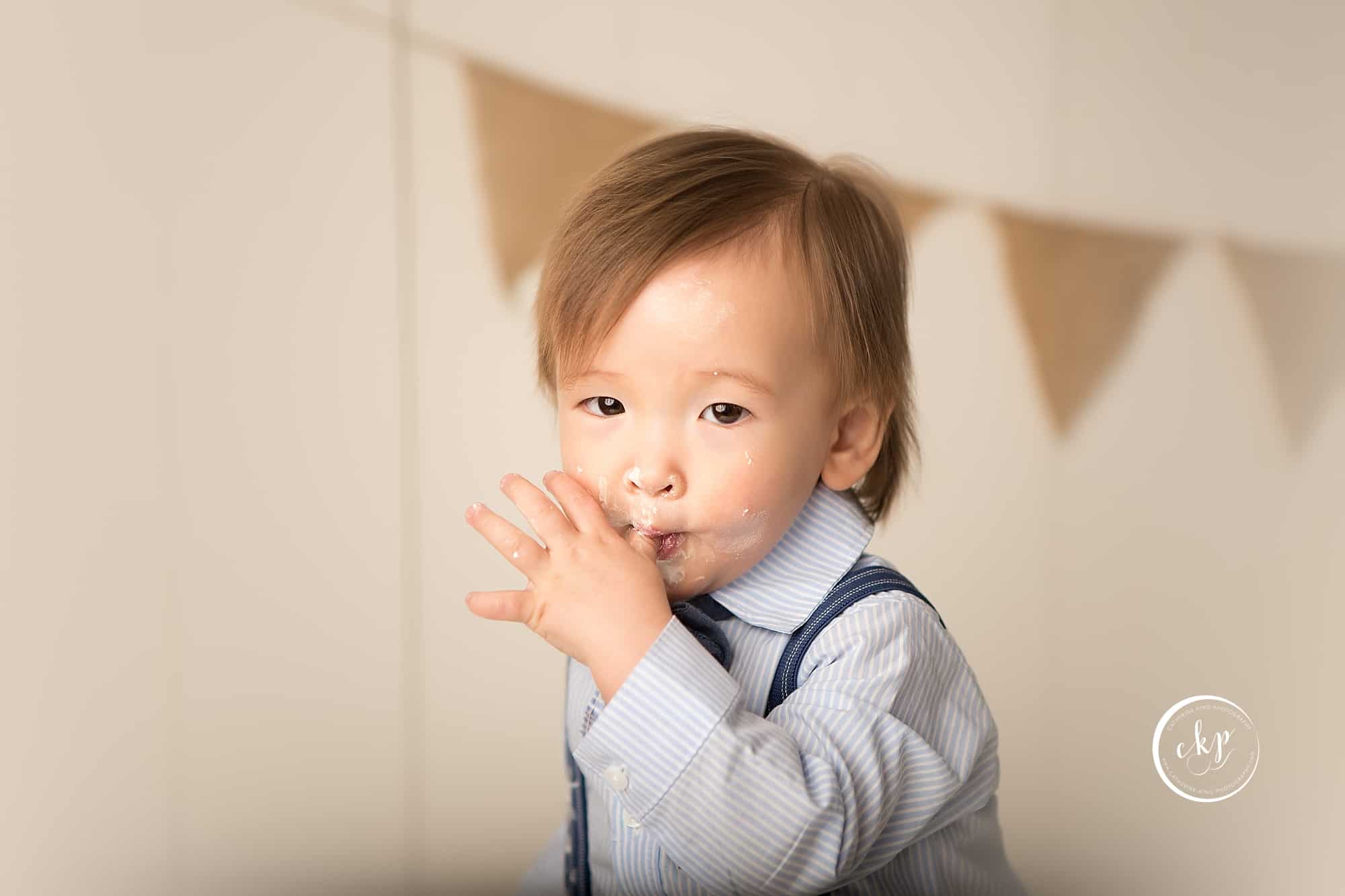 professional baby smashcake photography with 1 year old James